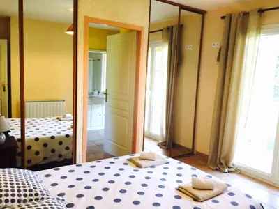 Un ou plusieurs lits dans un hébergement de l'établissement Villa Temara à Soustons Plage , piscine , Golf, Lac Marin