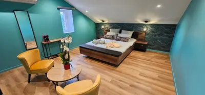 Un ou plusieurs lits dans un hébergement de l'établissement Abaca Colors