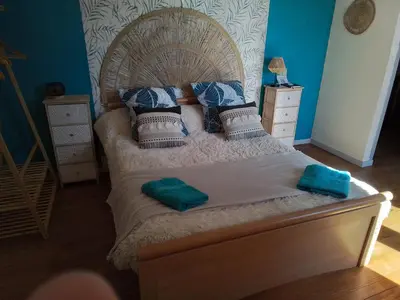 Un ou plusieurs lits dans un hébergement de l'établissement La chambre de jeny