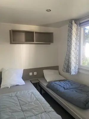 Un ou plusieurs lits dans un hébergement de l'établissement Mobil Home Casita 6-8 personnes, 3 chambres