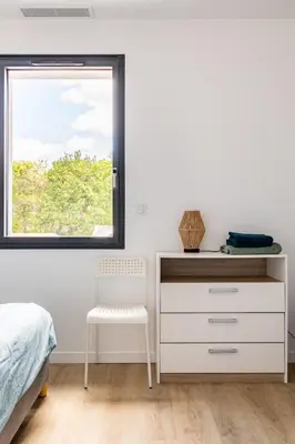 Un ou plusieurs lits dans un hébergement de l'établissement Maison vacances à Labenne