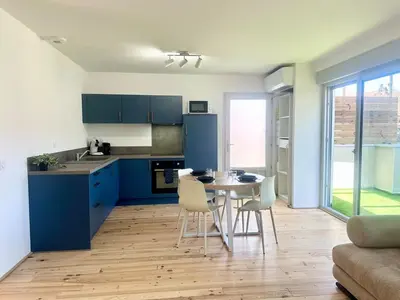 Cuisine ou kitchenette dans l'établissement Le Patio - Parking privé - Terrasse