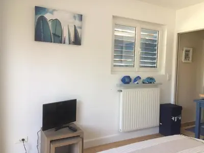 Télévision ou salle de divertissement dans l'établissement Cap Mango Paradise