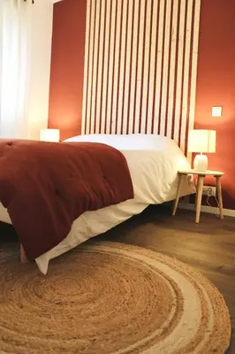Un ou plusieurs lits dans un hébergement de l'établissement Maison climatisée 3 chambres avec jardin