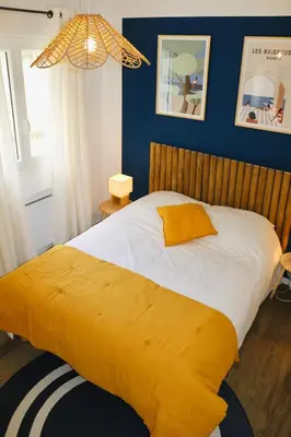 Un ou plusieurs lits dans un hébergement de l'établissement Maison climatisée 3 chambres avec jardin