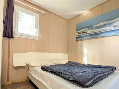 Un ou plusieurs lits dans un hébergement de l'établissement Chalet confortable avec terrasse pour 7 personnes - API-1-52-227