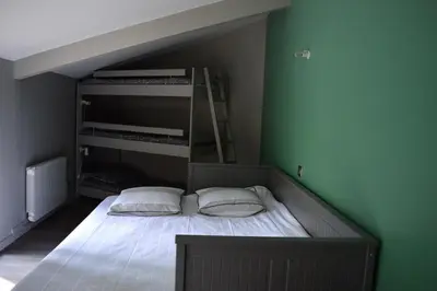 Un ou plusieurs lits dans un hébergement de l'établissement Villa Hossegor 8 personnes proche du Lac