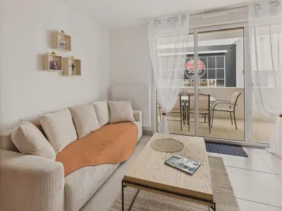 Coin salon dans l'établissement Plein centre - Appart pour 6 avec balcon