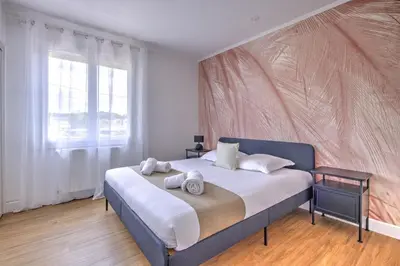 Un ou plusieurs lits dans un hébergement de l'établissement Villa Manava - Climatisée avec terrasse et jardin