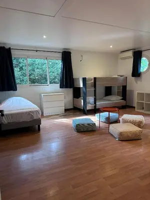 Un ou plusieurs lits dans un hébergement de l'établissement Le Tuc Lodge