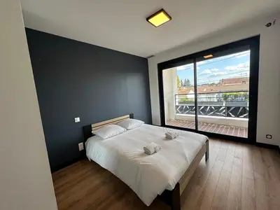Un ou plusieurs lits dans un hébergement de l'établissement La Villa Estienne - Spacieuse - Conviviale - 6 Chambres - Parking privé