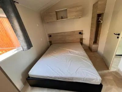 Un ou plusieurs lits dans un hébergement de l'établissement 531 Mobi-Chalet 3 chambres 2 sd Bassin d'Arcachon