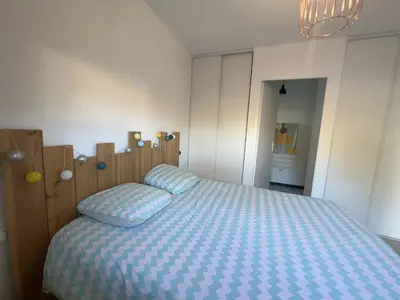Un ou plusieurs lits dans un hébergement de l'établissement Maison bois 4 Ch Piscine & Spa proche Contis Océan