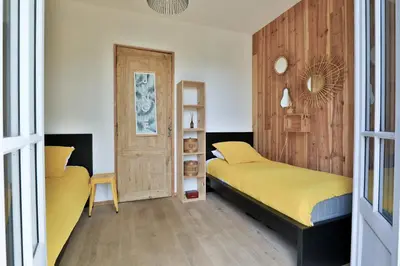 Un ou plusieurs lits dans un hébergement de l'établissement Villa Honora - Joli maison arcachonnaise à Cazaux