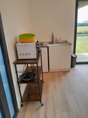 Cuisine ou kitchenette dans l'établissement Appartement dans grange rénovée