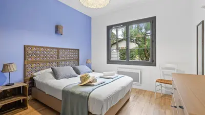 Un ou plusieurs lits dans un hébergement de l'établissement Maison de charme avec jardin et terrasse - Pyla