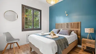 Un ou plusieurs lits dans un hébergement de l'établissement Maison de charme avec jardin et terrasse - Pyla