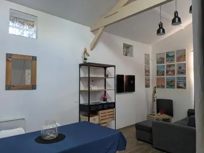 Télévision ou salle de divertissement dans l'établissement Le Loumama - Grange rénovée, refuge familial entre Bordeaux et le Bassin