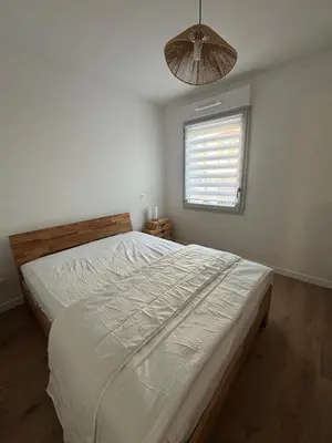 Un ou plusieurs lits dans un hébergement de l'établissement Appartement neuf
