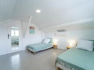 Un ou plusieurs lits dans un hébergement de l'établissement Maison rénovée à Mimizan pour 10 pers. avec jardin proche océan - FR-1-50-194
