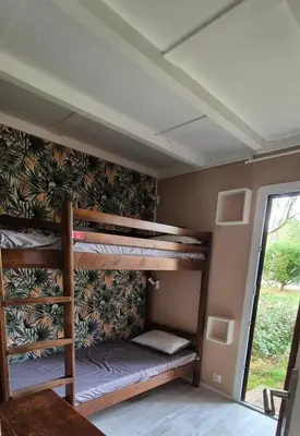 Un ou plusieurs lits dans un hébergement de l'établissement Léon Apartment