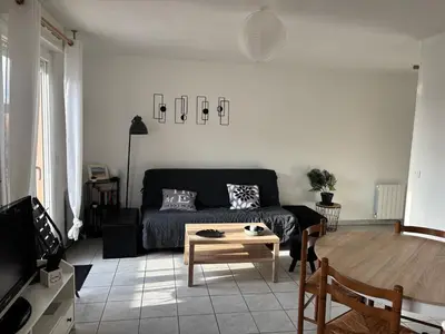 Coin salon dans l'établissement Le petit nid douillet du Bassin T2