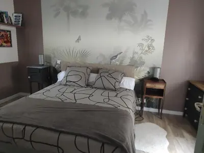 Un ou plusieurs lits dans un hébergement de l'établissement Petite maison cosy l'Ermitage