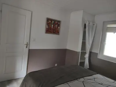 Un ou plusieurs lits dans un hébergement de l'établissement Petite maison cosy l'Ermitage