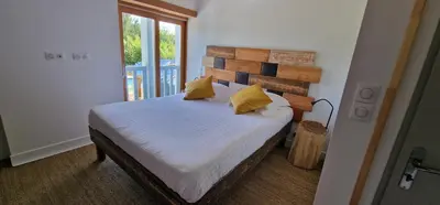 Un ou plusieurs lits dans un hébergement de l'établissement Jack's Lodge - La Grange
