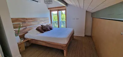 Un ou plusieurs lits dans un hébergement de l'établissement Jack's Lodge - La Grange