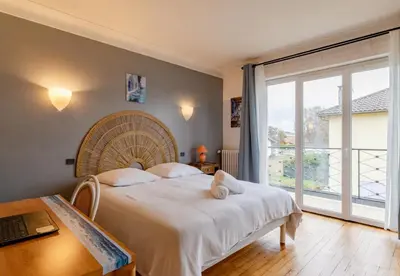 Un ou plusieurs lits dans un hébergement de l'établissement Villa Amistad - centre - parking - jardin - lave linge et vaisselle