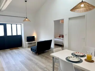 Un ou plusieurs lits dans un hébergement de l'établissement L'Atelier des Couleurs - T2 Neuf - plain-pied