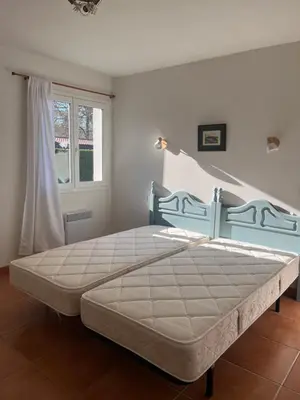 Un ou plusieurs lits dans un hébergement de l'établissement Maison chaleureuse