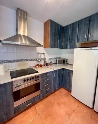Cuisine ou kitchenette dans l'établissement Maison chaleureuse