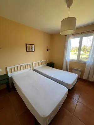 Un ou plusieurs lits dans un hébergement de l'établissement Maison chaleureuse