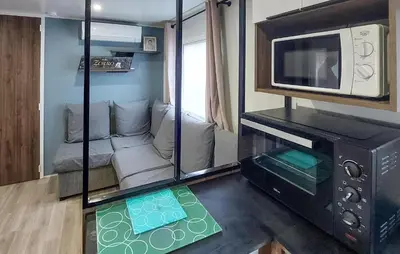 Coin salon dans l'établissement Joli Mobil Home Proche Océan