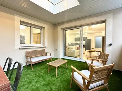 Coin salon dans l'établissement Les Suites de Molière