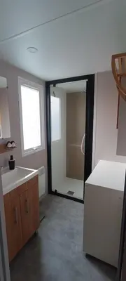 Cuisine ou kitchenette dans l'établissement Mobil home chez Thierry et Véro