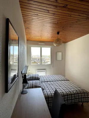 Un ou plusieurs lits dans un hébergement de l'établissement Bel appartement , 2 chambres, idéalement situé