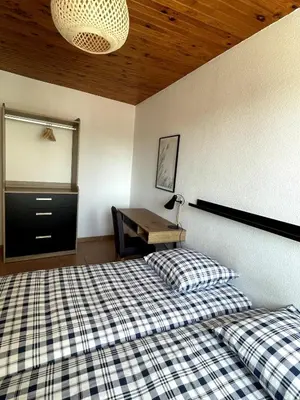 Un ou plusieurs lits dans un hébergement de l'établissement Bel appartement , 2 chambres, idéalement situé