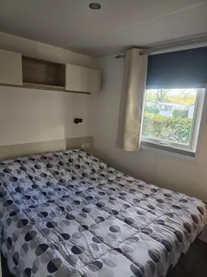 Un ou plusieurs lits dans un hébergement de l'établissement Mobil home 8 personnes Gastes