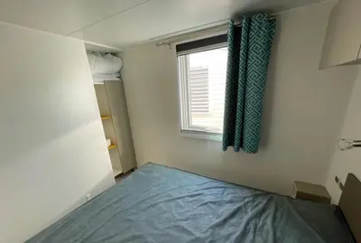 Un ou plusieurs lits dans un hébergement de l'établissement Mobil home G107 Camping les VIGNES Lit-et-Mixe