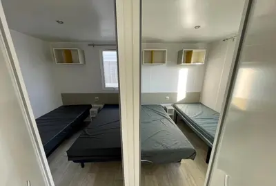 Un ou plusieurs lits dans un hébergement de l'établissement Mobil home G107 Camping les VIGNES Lit-et-Mixe