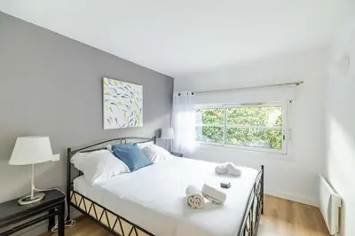 Un ou plusieurs lits dans un hébergement de l'établissement Villa 105 m proche océan avec piscine et jardin