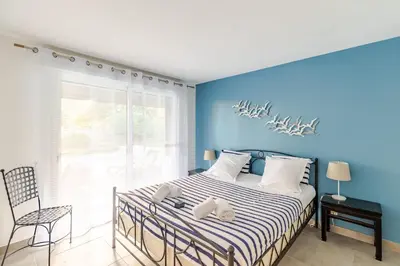 Un ou plusieurs lits dans un hébergement de l'établissement Villa 105 m proche océan avec piscine et jardin