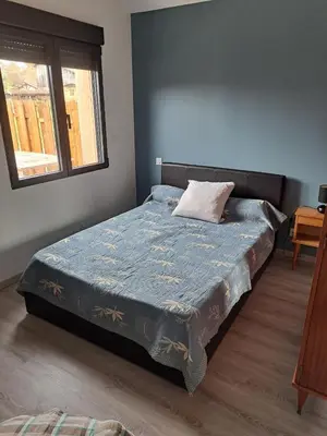 Un ou plusieurs lits dans un hébergement de l'établissement Maison style chalet
