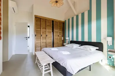 Un ou plusieurs lits dans un hébergement de l'établissement Villa Domus Sciurorum – Pyla-sur-Mer (Domaine Forestier)