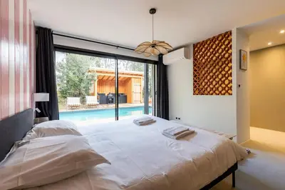 Un ou plusieurs lits dans un hébergement de l'établissement Villa Domus Sciurorum – Pyla-sur-Mer (Domaine Forestier)