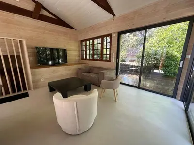 Télévision ou salle de divertissement dans l'établissement Le Refuge du Pyla