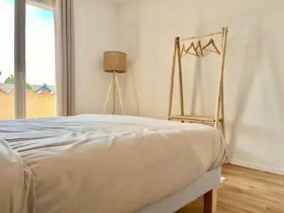 Un ou plusieurs lits dans un hébergement de l'établissement Jolie maison de vacances 8 personnes - Piscine commune à la résidence